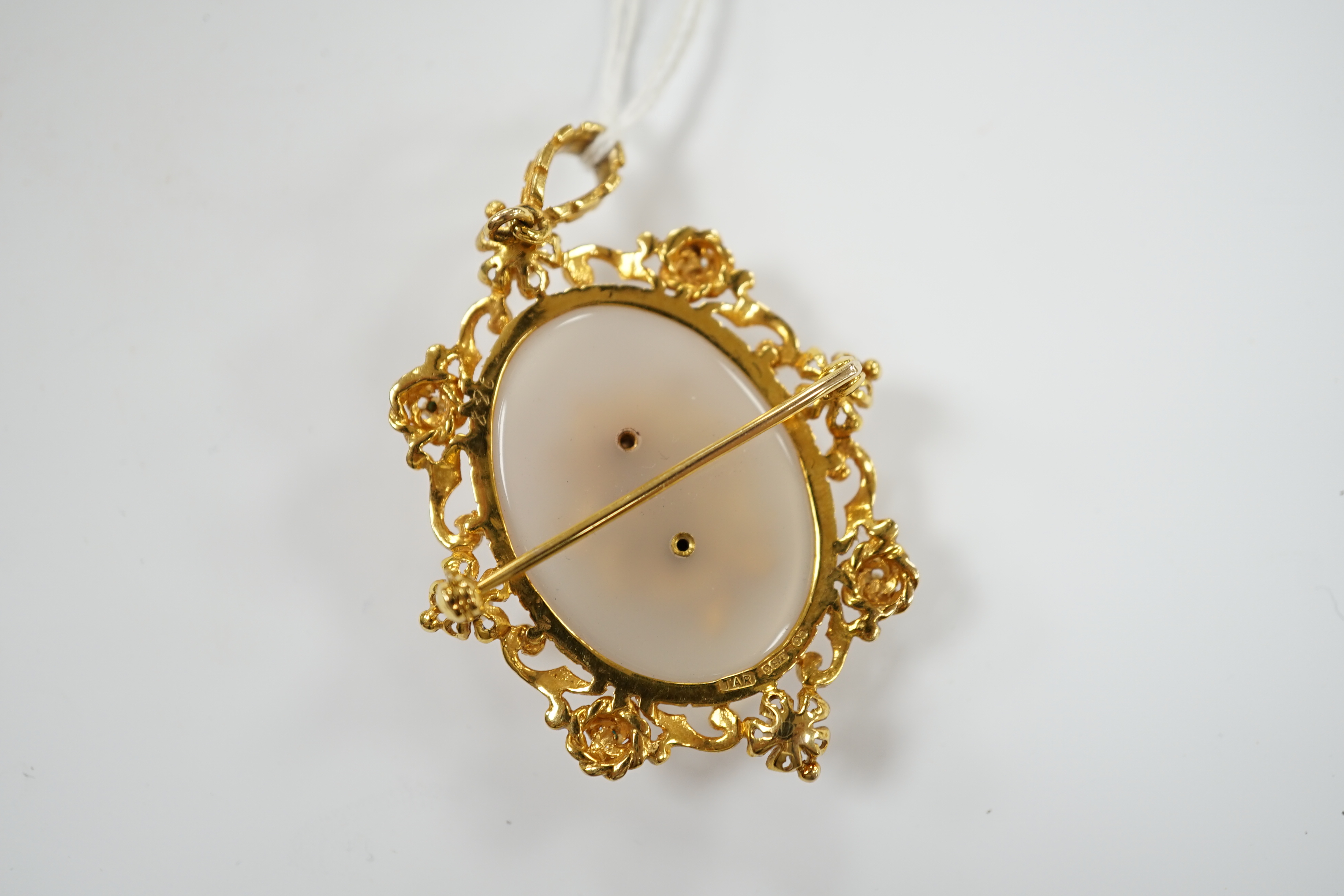 A 1970's Victorian style 9ct gold, white chalcedony, turquoise and seed pearl set pendant brooch, overall 59mm, gross weight 16.8 grams.